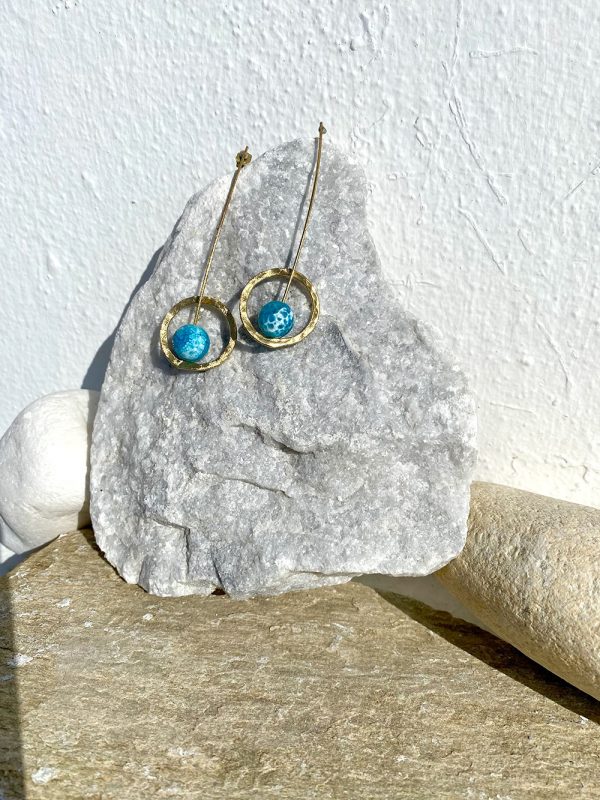 Gold earrings with blue stones