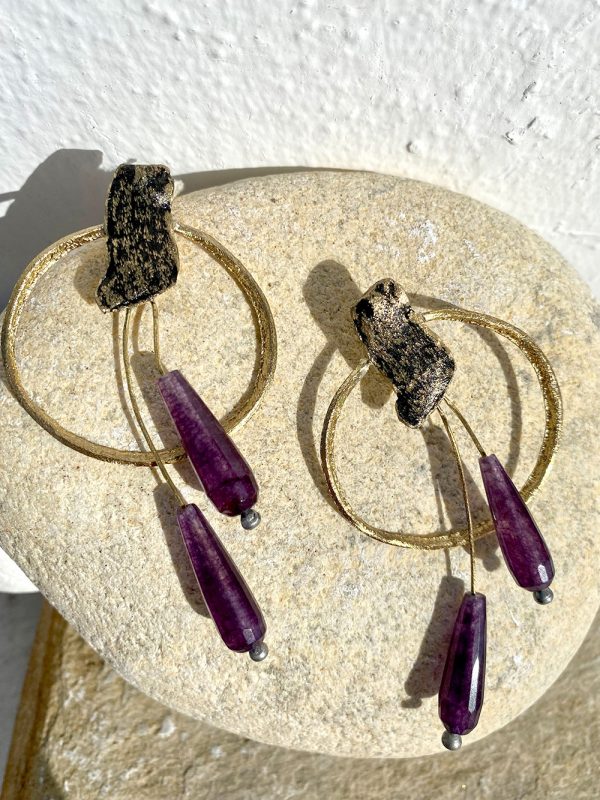 Gold earrings with purple stones